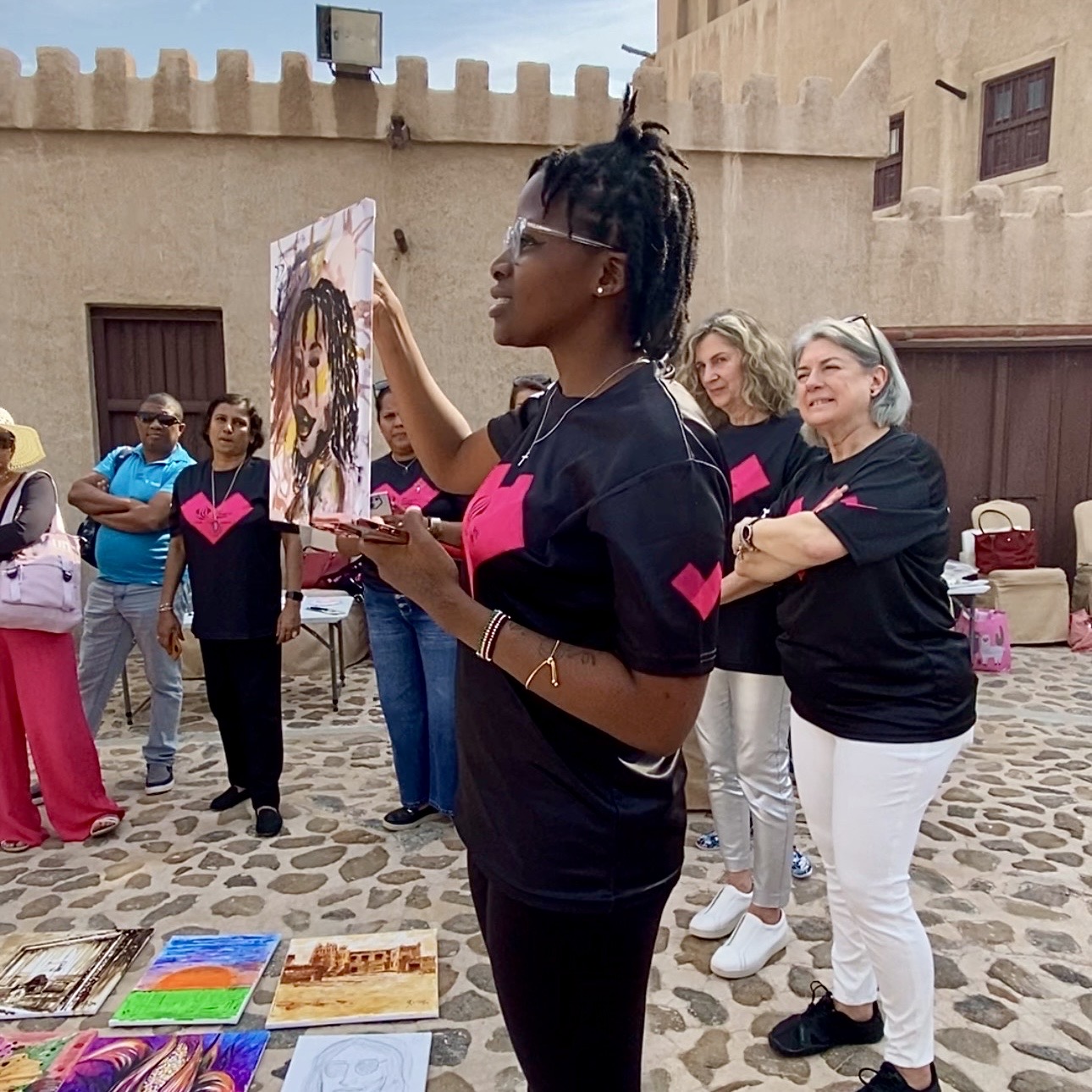 Malinga speaking about her work at a cultural tour at the Ajman Museum with fellow ambassadors, 2024